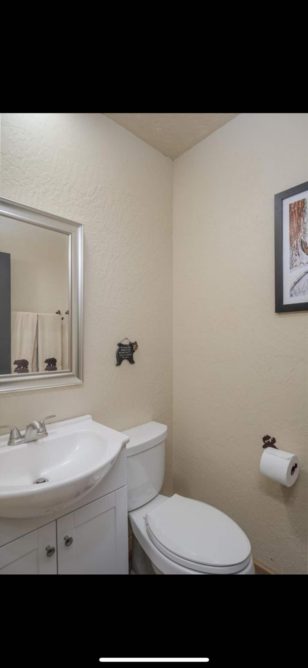 Convenient half bathroom near the game room