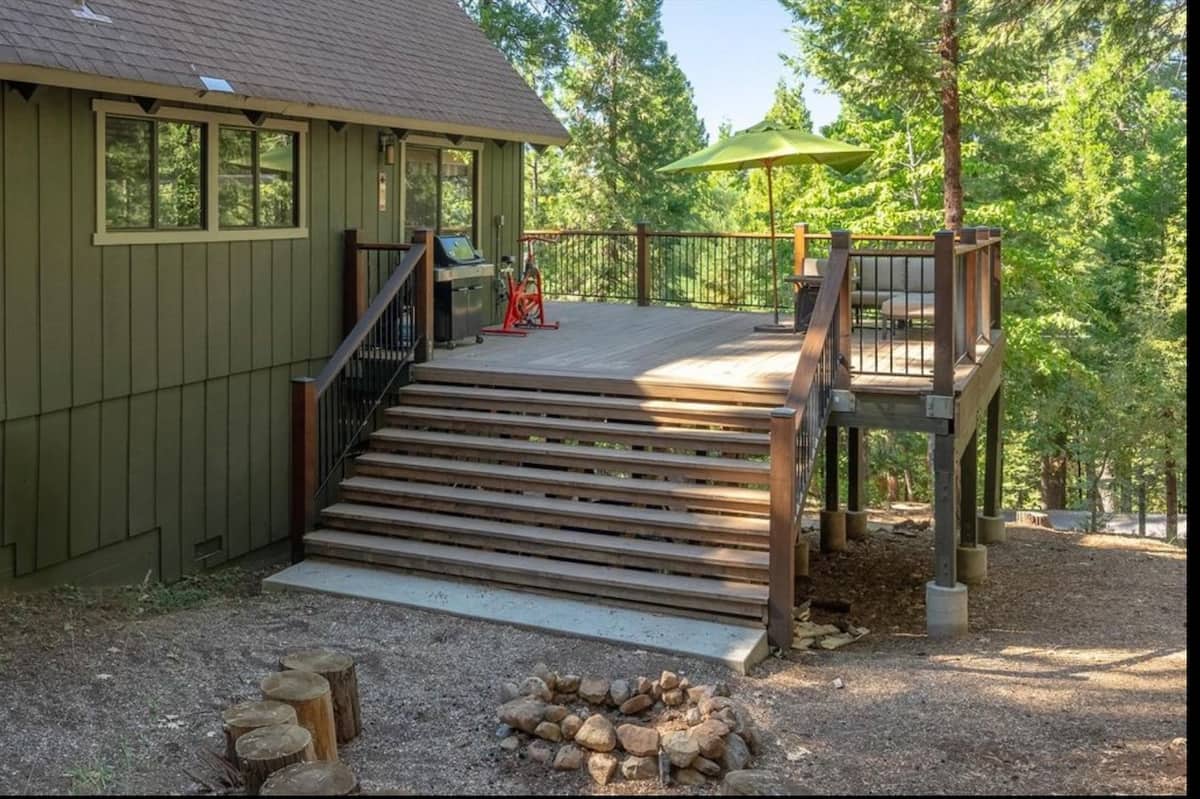 Lower deck steps beside the outdoor fire pit