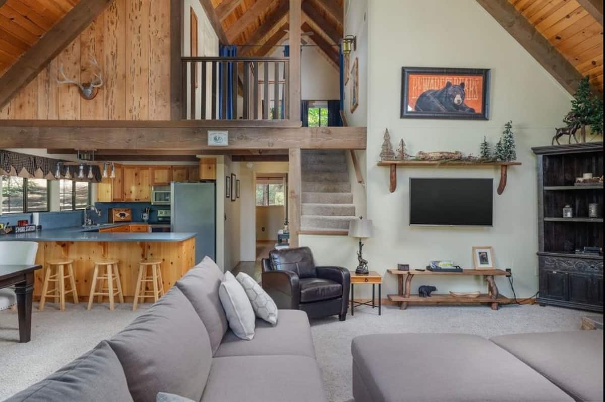 Open great room with kitchen, dining, and loft above