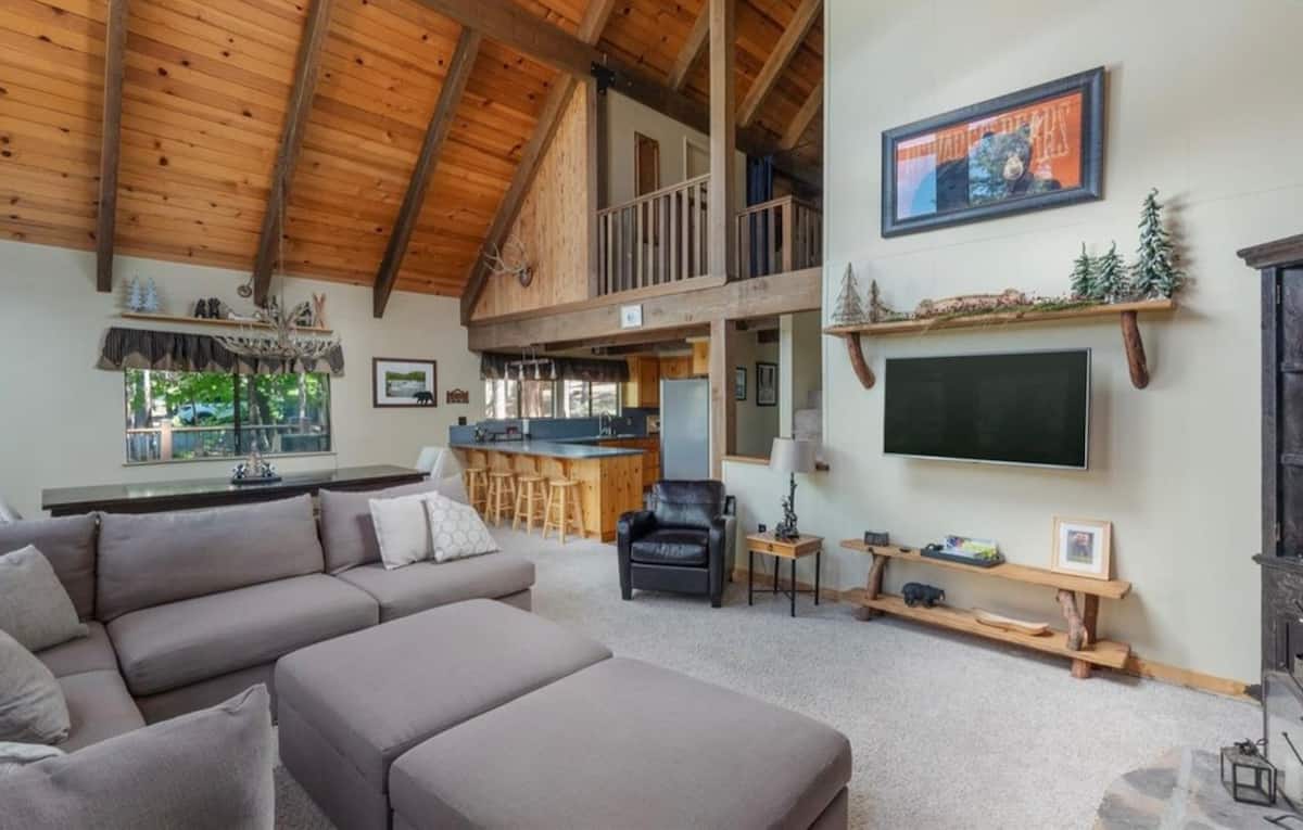 Spacious family room beneath the timber ceiling