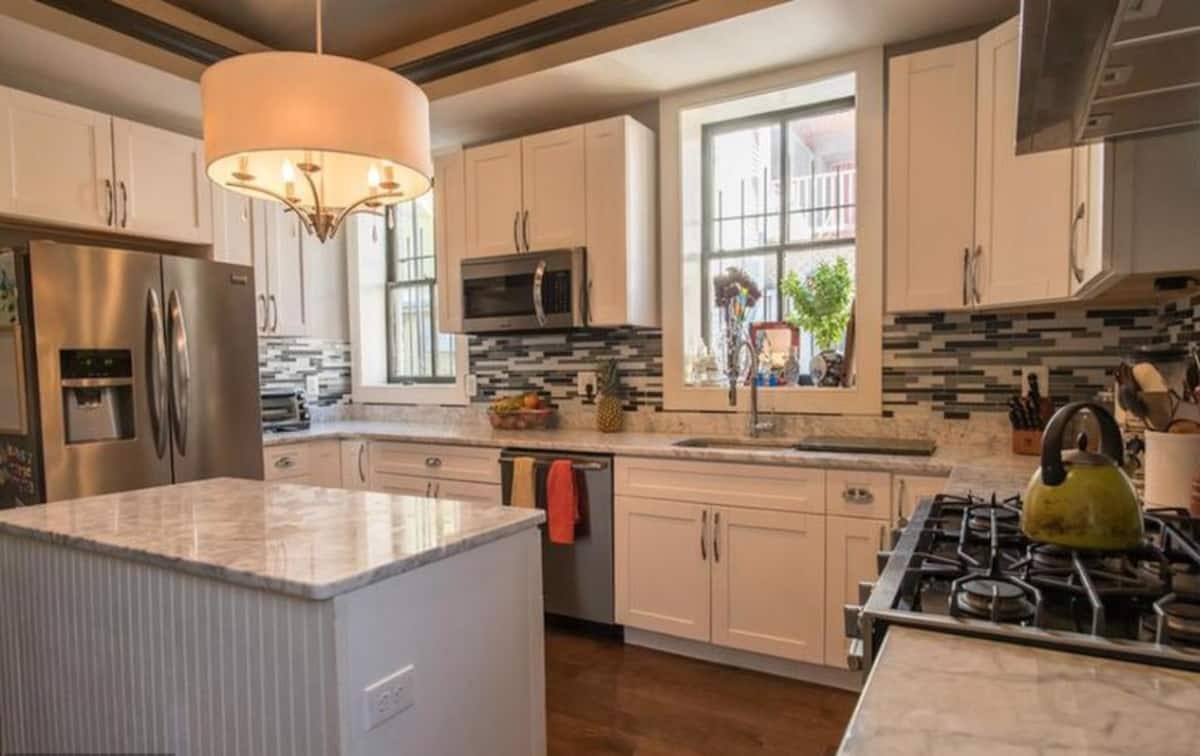 Fully stocked kitchen with marble worktops and stainless appliances