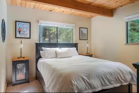 Calm guest bedroom with a queen bed
